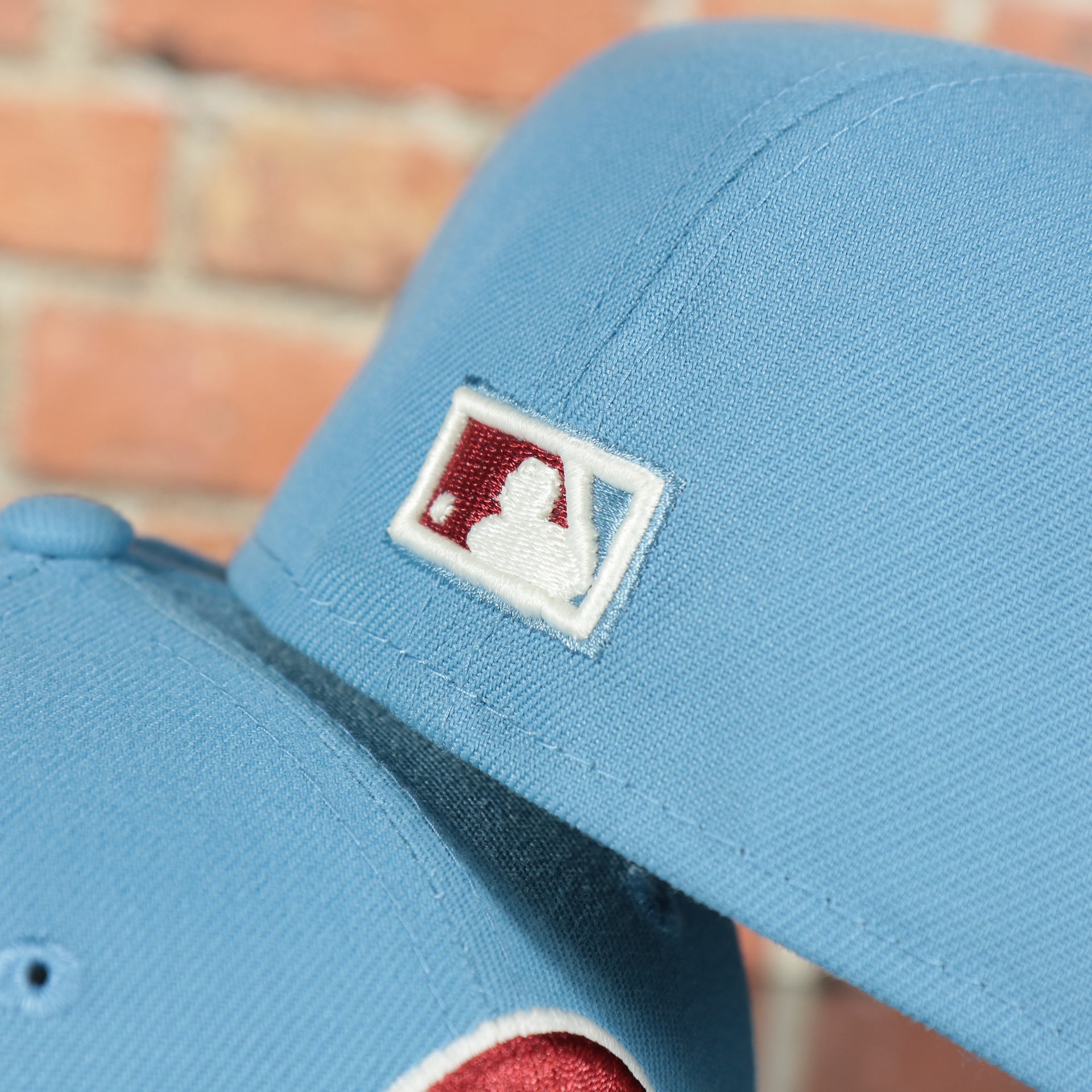 cooperstown batterman logo on the Philadelphia Phillies 1980 World Series Glow In The Dark Pink Brim 59fifty Fitted Cap | Sky Blue