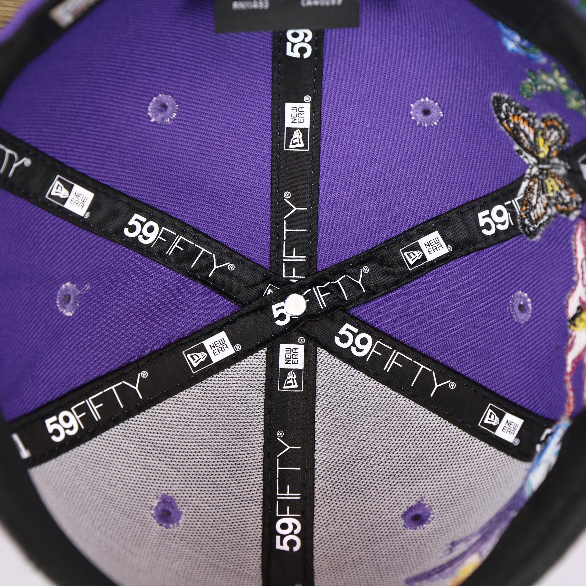The inside of the Cooperstown Arizona Diamondbacks Gray Bottom Bloom Spring Embroidery 59Fifty Fitted Cap | Purple 59Fifty Cap