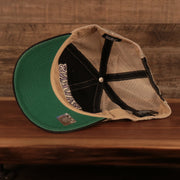 underside of the Baltimore Ravens Black Adjustable Green Bottom Trucker Cap