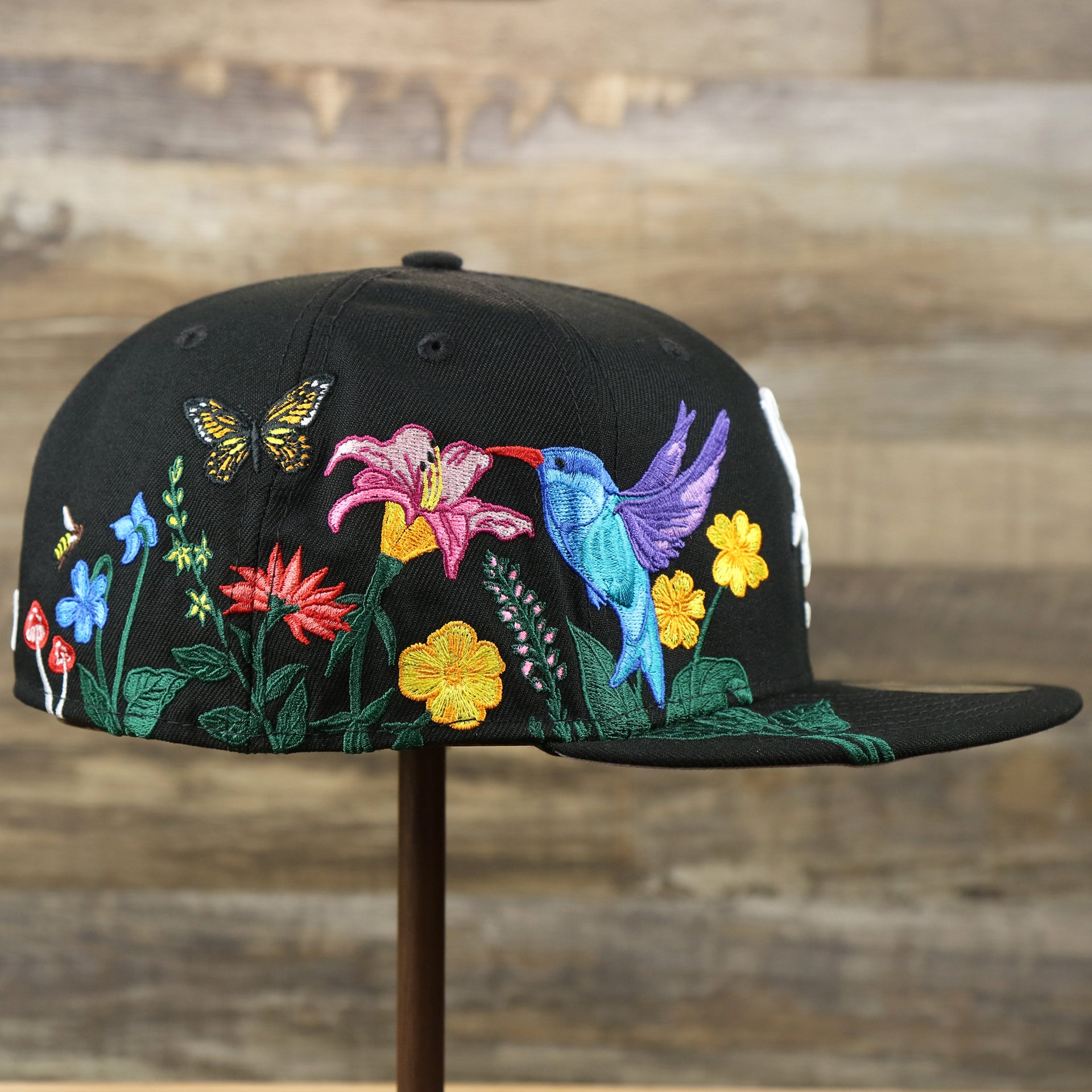 The wearer's right on the Chicago White Sox Gray Bottom Bloom Spring Embroidery 59Fifty Fitted Cap | Black 59Fifty Cap