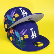 The Los Angeles Dodgers Gray Bottom Bloom Spring Embroidery 59Fifty Fitted Cap | Royal Blue 59Fifty Cap on top of another cap