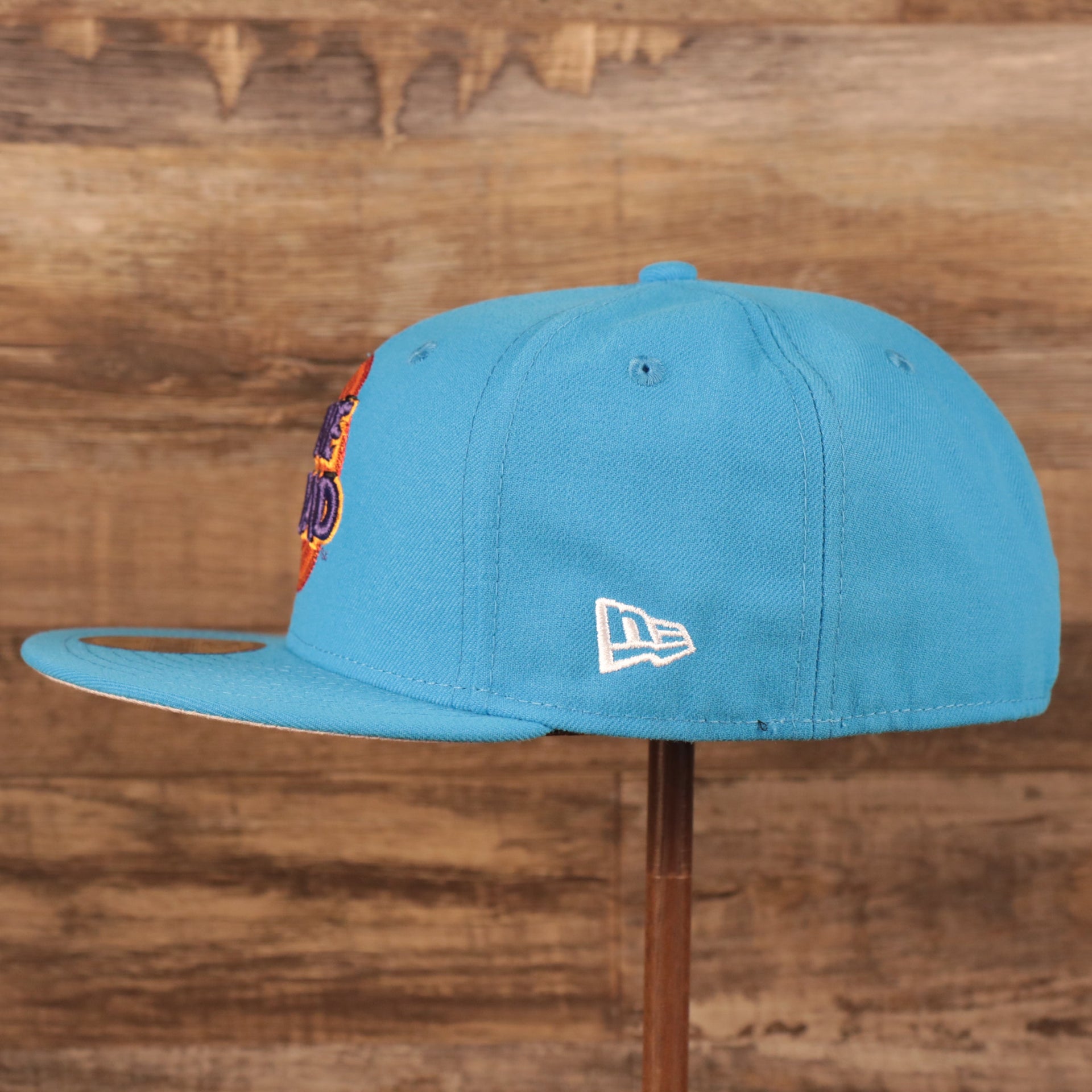 Wearer's left of Tune Squad Shield Lebron 18 Space Jam Matching 59Fifty Fitted Cap | Blue