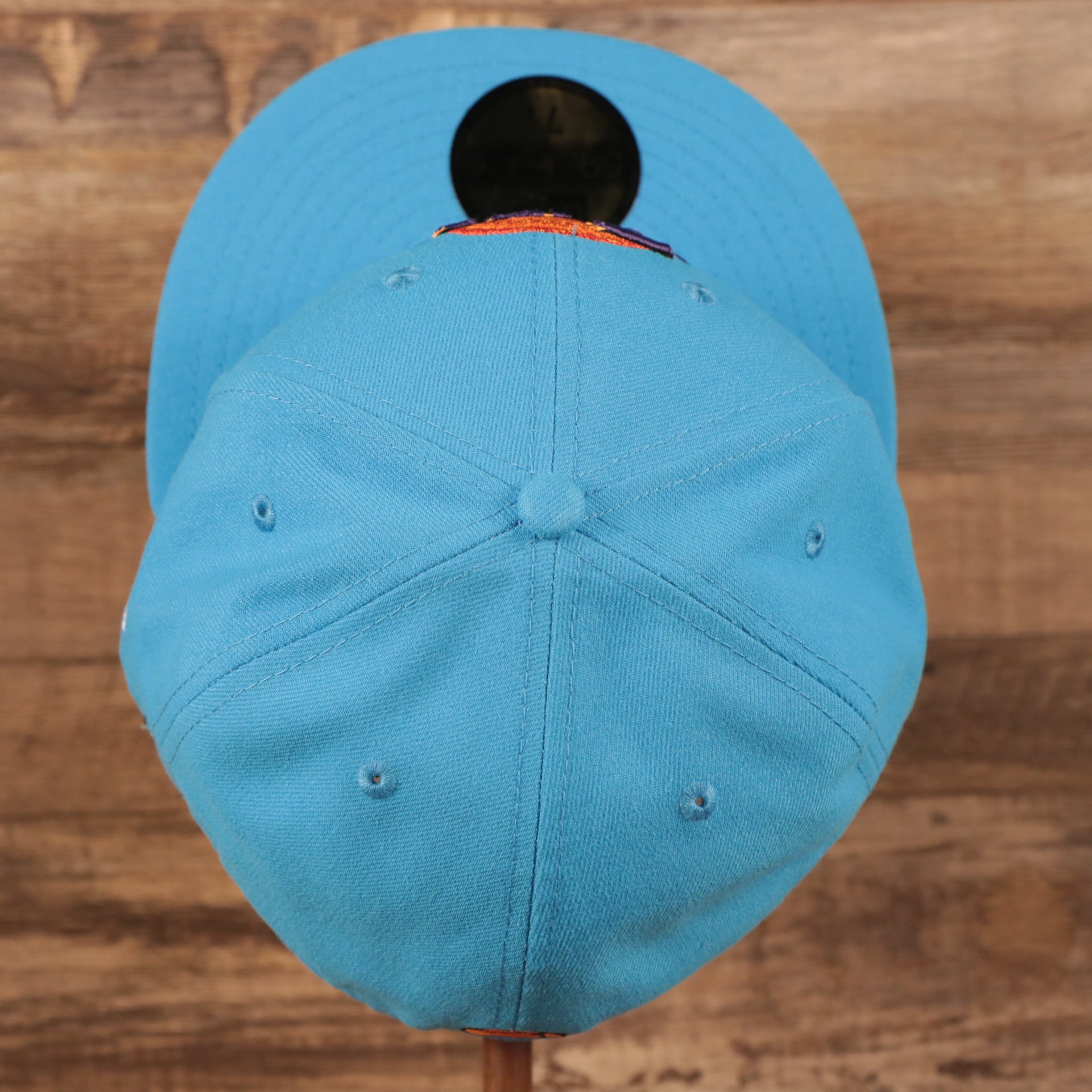 Top down view of the Tune Squad Shield Lebron 18 Space Jam Matching 59Fifty Fitted Cap | Blue