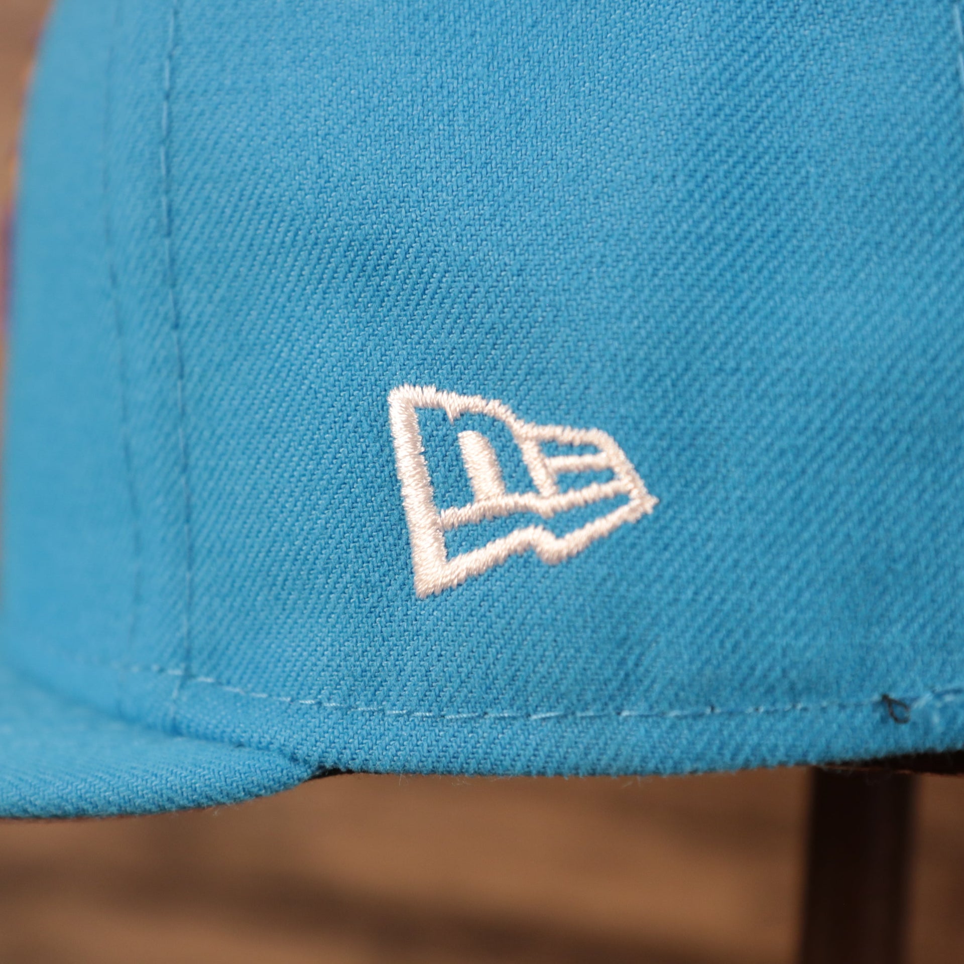 New Era logo of the Tune Squad Shield Lebron 18 Space Jam Matching 59Fifty Fitted Cap | Blue