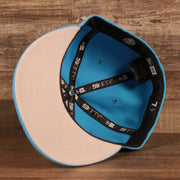 Grey under visor on the Tune Squad Shield Lebron 18 Space Jam Matching 59Fifty Fitted Cap | Blue