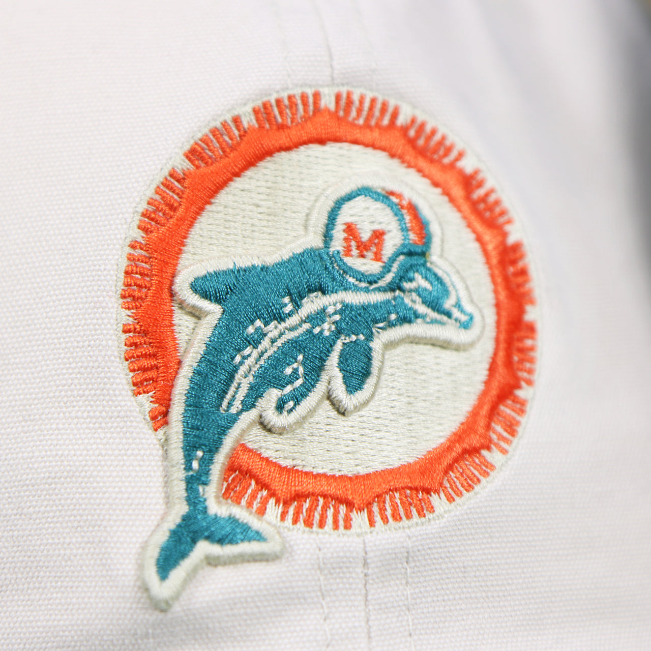 The Legacy Miami Dolphins Logo on the Throwback Miami Dolphins NFL Wordmark Side Patch Legacy Dad Hat | Bone Dad Hat