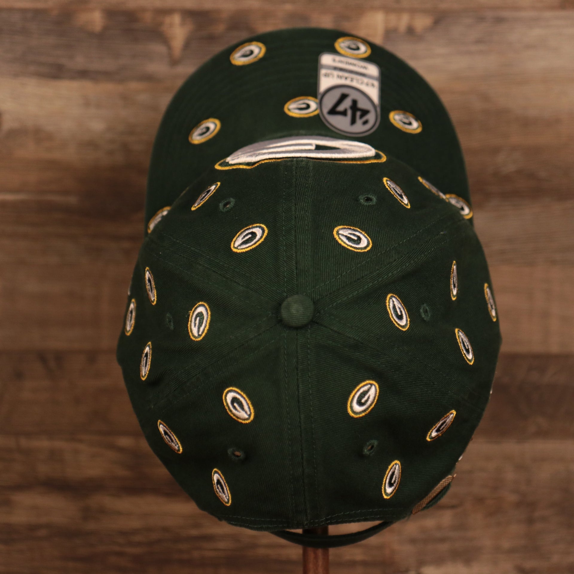 top view of the Green Bay Packers All Over Logo Patch Green Adjustable Dad Hat