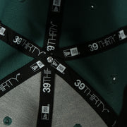 new era taping on the Philadelphia Eagles 2019 NFL Draft Team Color Midnight Green 39Thirty Flexfit Cap