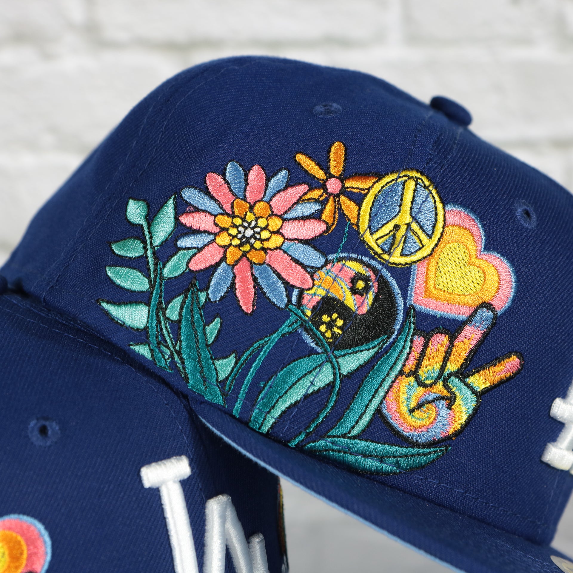 groovy side patch on the Los Angeles Dodgers Groovy World Series Champions Patch 59Fifty Fitted Cap | New Era Groovy Side Patch 5950
