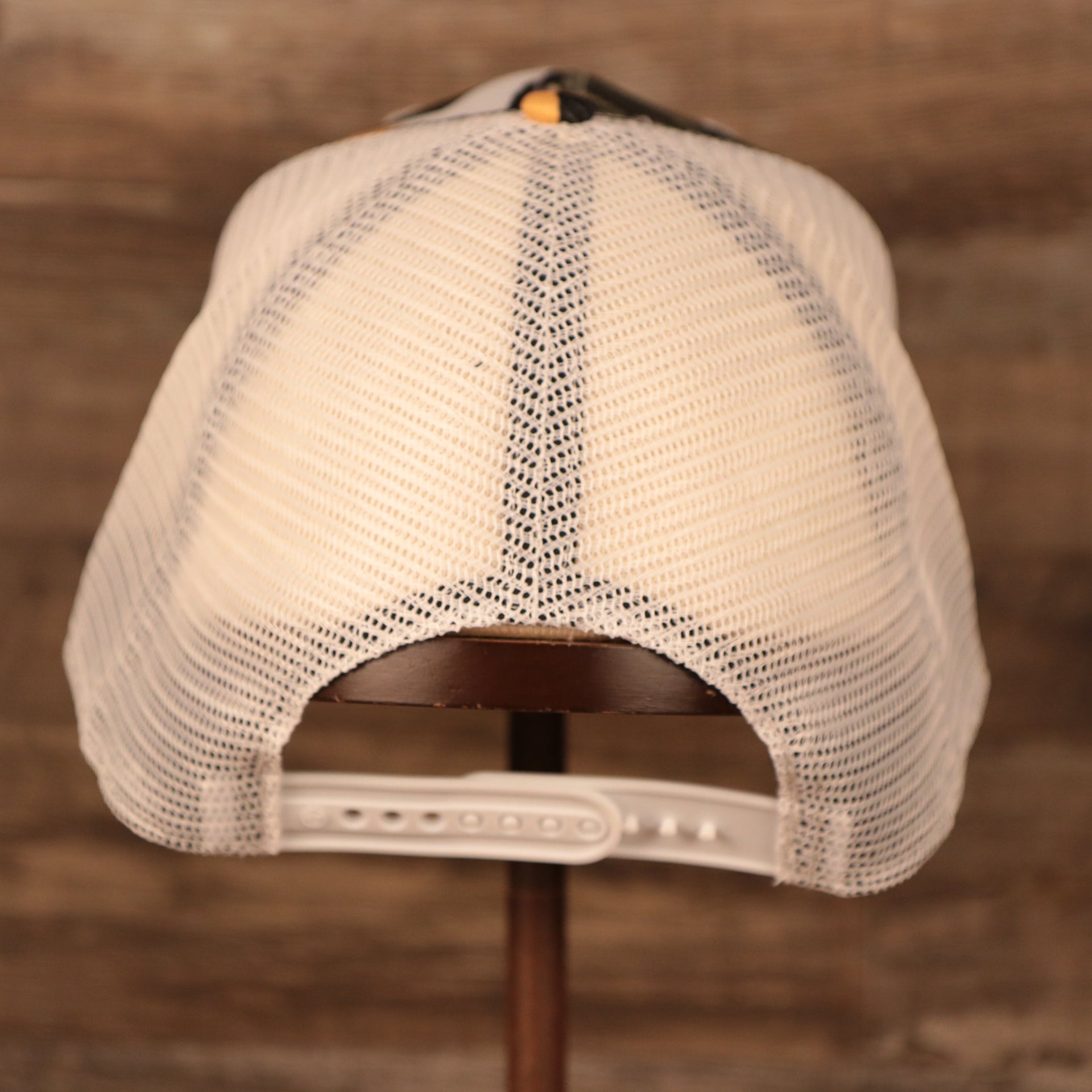 back side of the Boston Bruins Brown, White, and Yellow Retro Adjustable Trucker Dad Hat