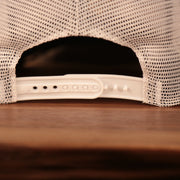 adjustable strap on the back of the Boston Bruins Brown, White, and Yellow Retro Adjustable Trucker Dad Hat