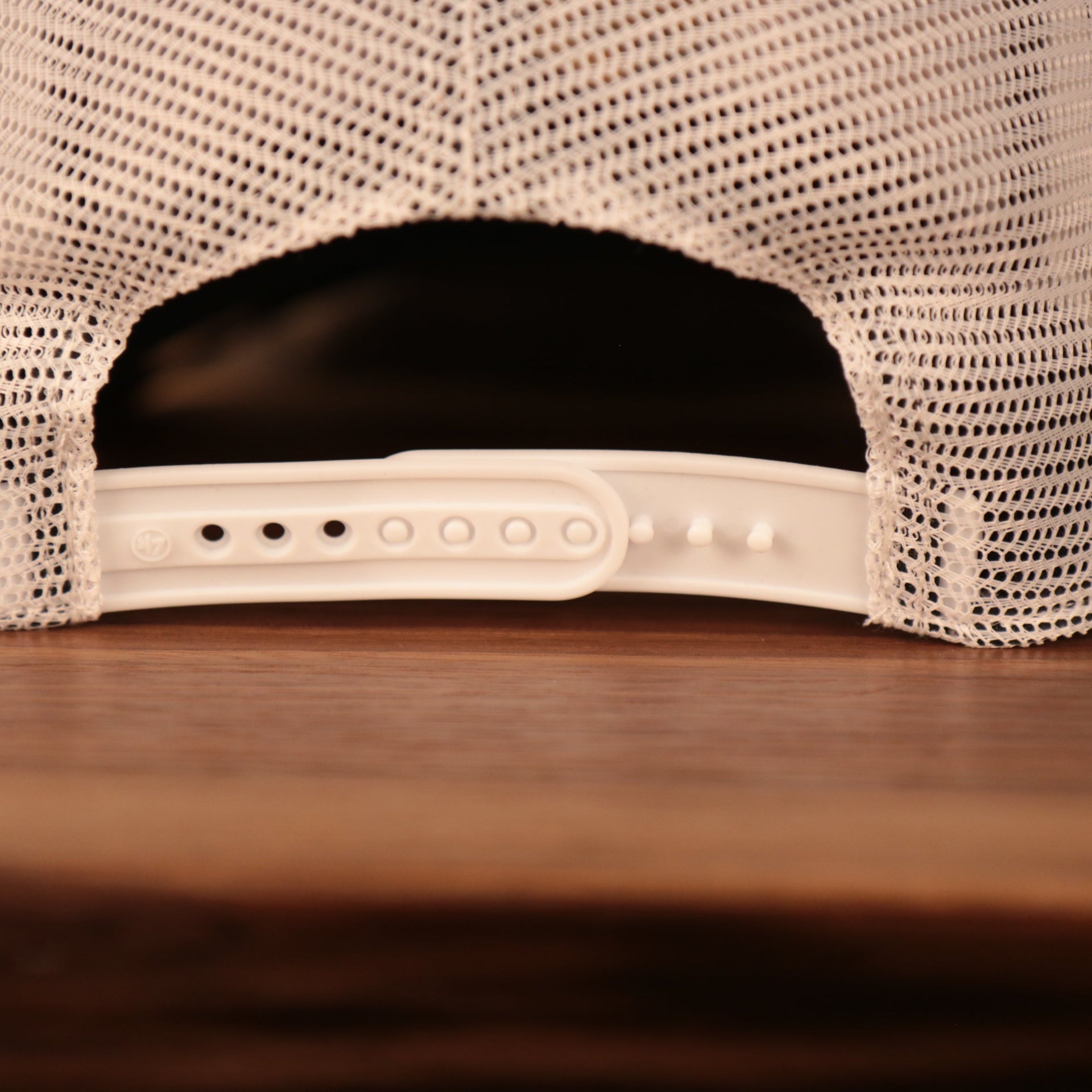 adjustable strap on the back of the Boston Bruins Brown, White, and Yellow Retro Adjustable Trucker Dad Hat