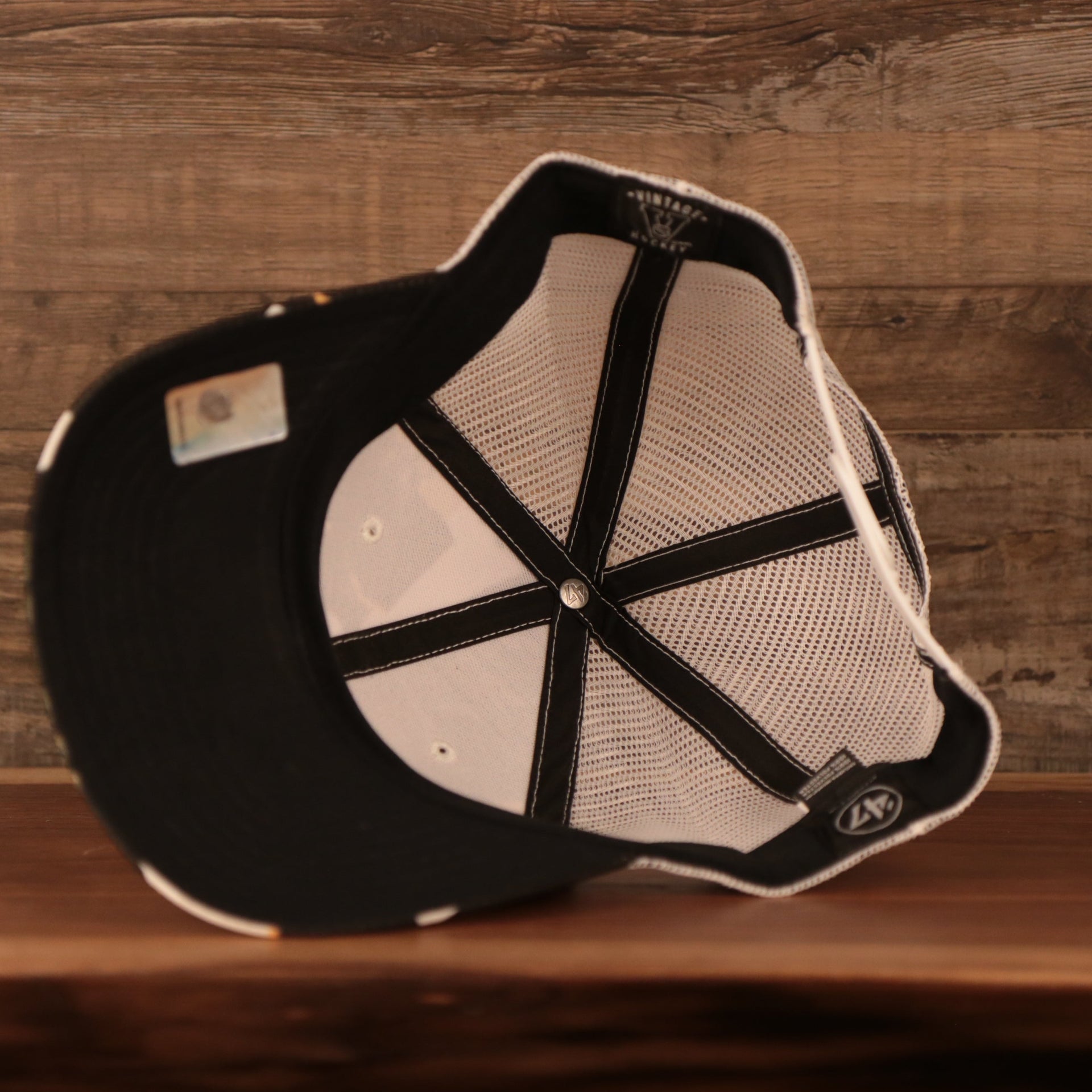 underside of the Boston Bruins Brown, White, and Yellow Retro Adjustable Trucker Dad Hat