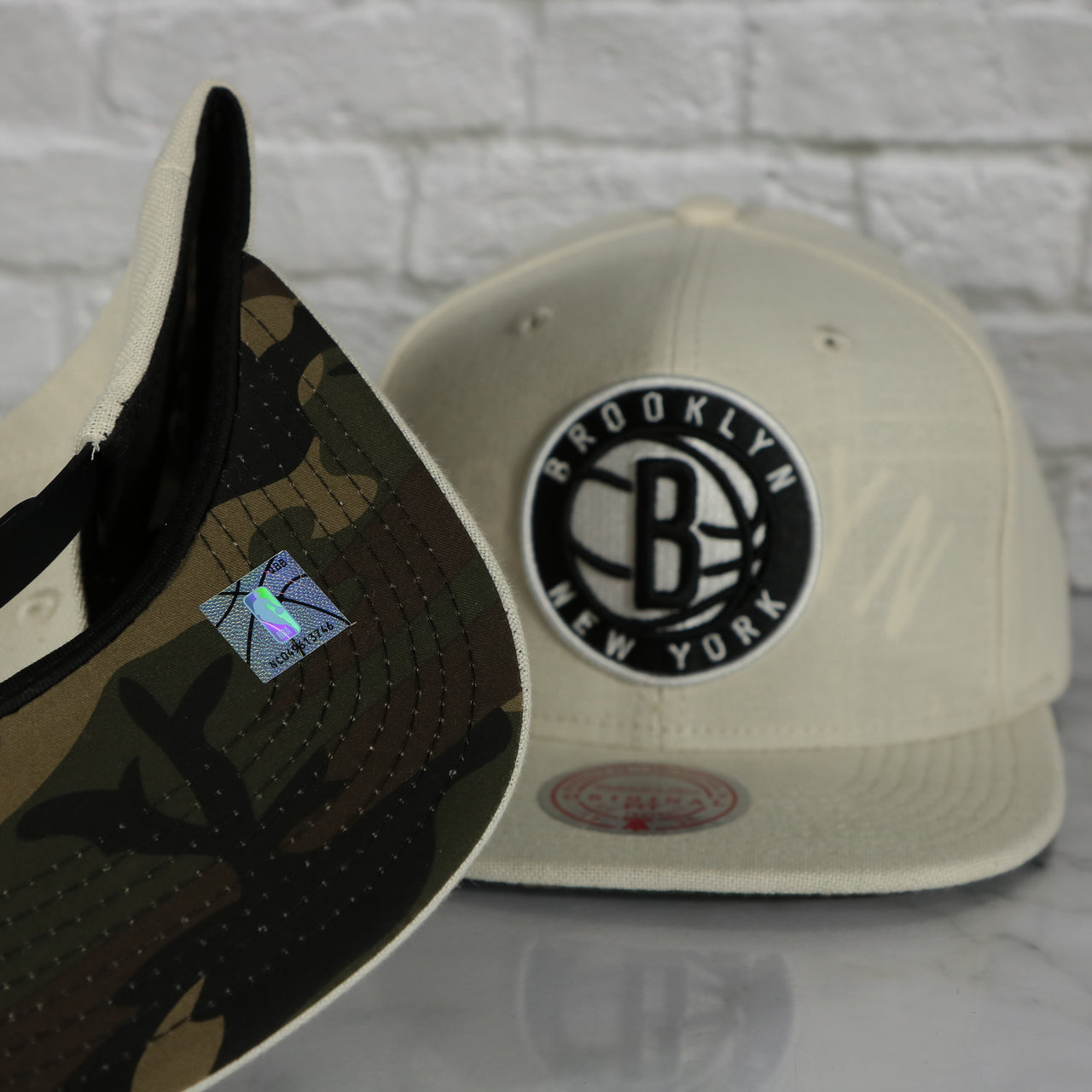 camo under visor on the Brooklyn Nets Cut Away Snapback Hat | Retro Mitchell and Ness Rip Away Distressed Snapback Hat