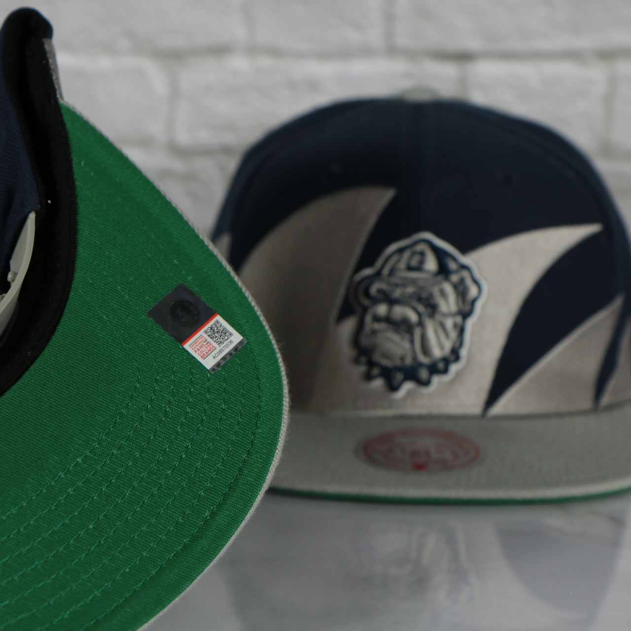 green under visor on the Georgetown University Hoyas Vintage Retro Sharktooth Mitchell and Ness Snapback Hat | Gray/Navy Blue