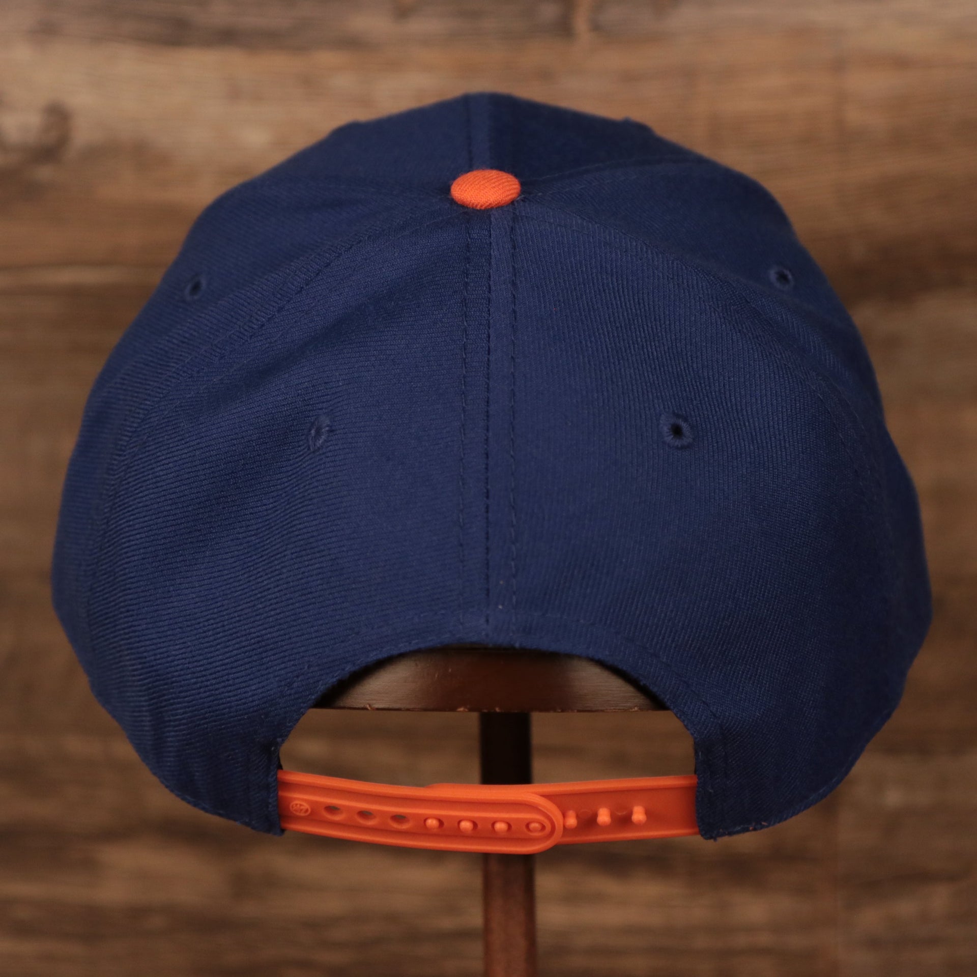 back view of the New York Knicks Royal Blue and Orange Adjustable Grey Bottom Snapback Hat