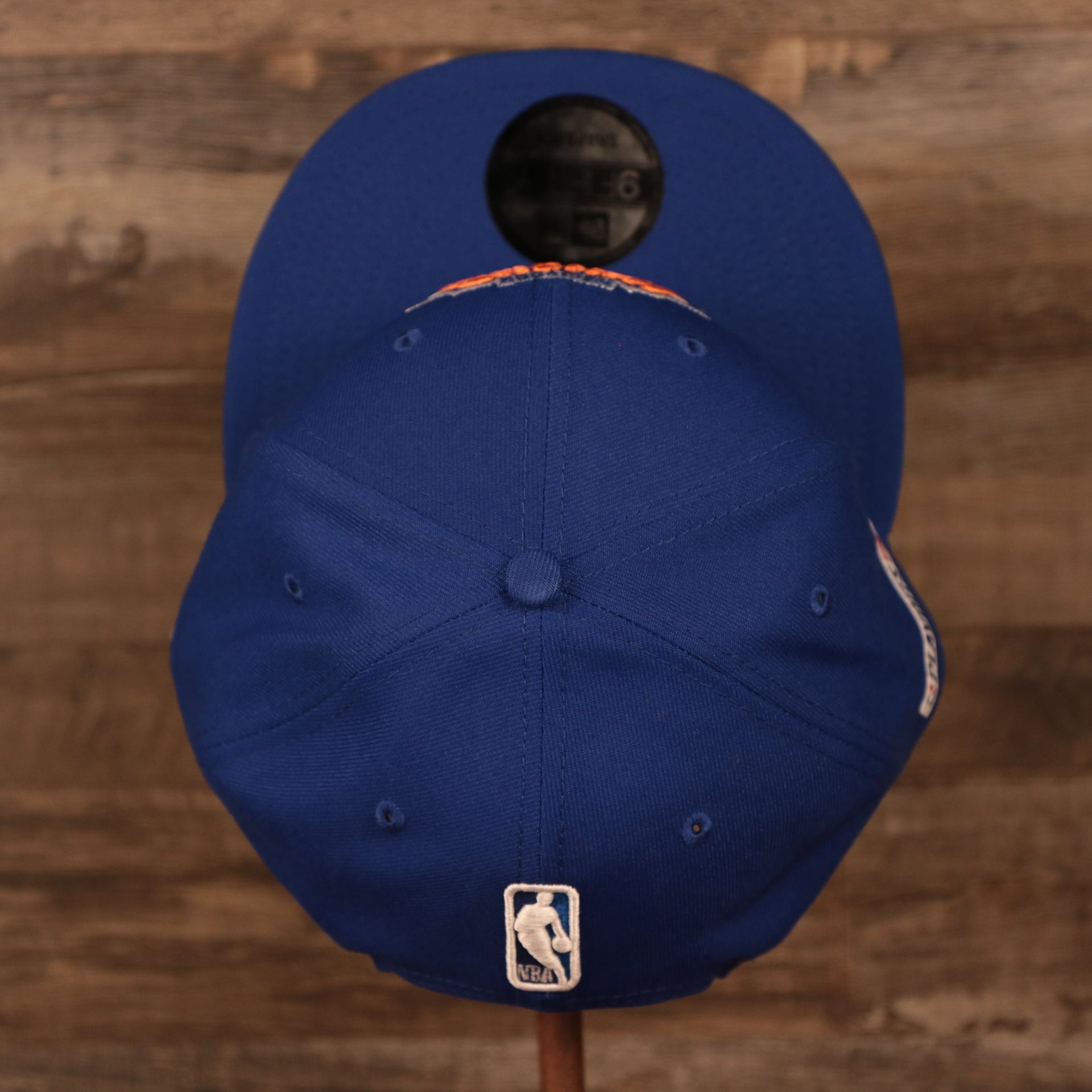 A top down view of the New York Knicks 2021 NBA Playoffs Snapback Hat, the hat features a 6 panel construction