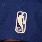 A close up shot of the NBA logo embroidered on the back of the 2021 NBA Playoffs New York Knicks snapback hat