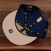 The under brim of the New York Knicks 2021 NBA Playoffs 9Fifty Gray Bottom Snapback Hat is gray