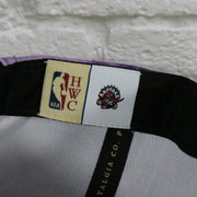 NBA hardwood classic label on the Toronto Raptors Galaxy Purple Reflective Script Mitchell and Ness Snapback Hat