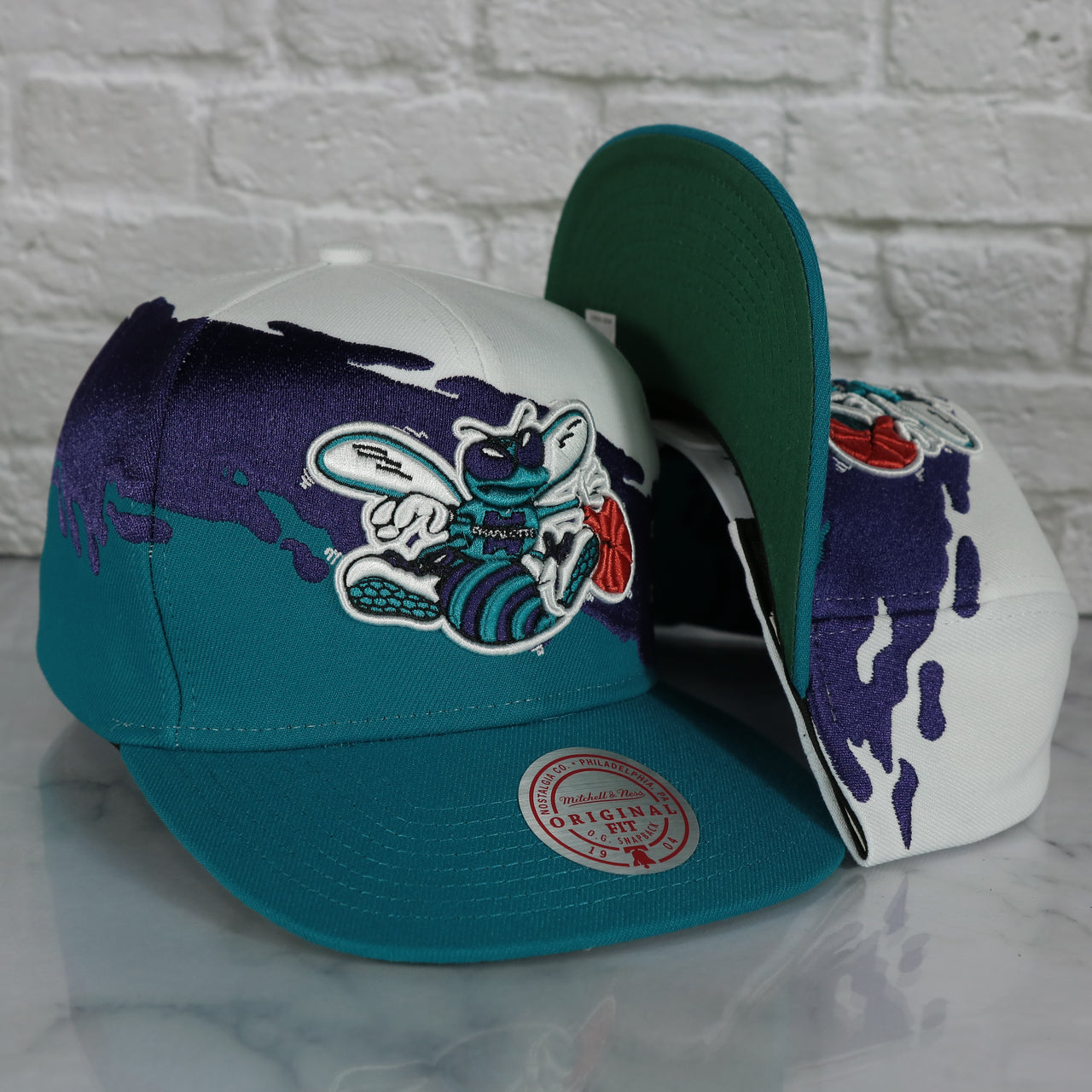 Charlotte Hornets Vintage Retro NBA Paintbrush Mitchell and Ness Snapback Hat | Purple/White/Teal