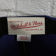 mitchell and ness label on the Phoenix Suns Vintage Retro NBA Team Ground 2.0 Mitchell and Ness Snapback Hat | Purple