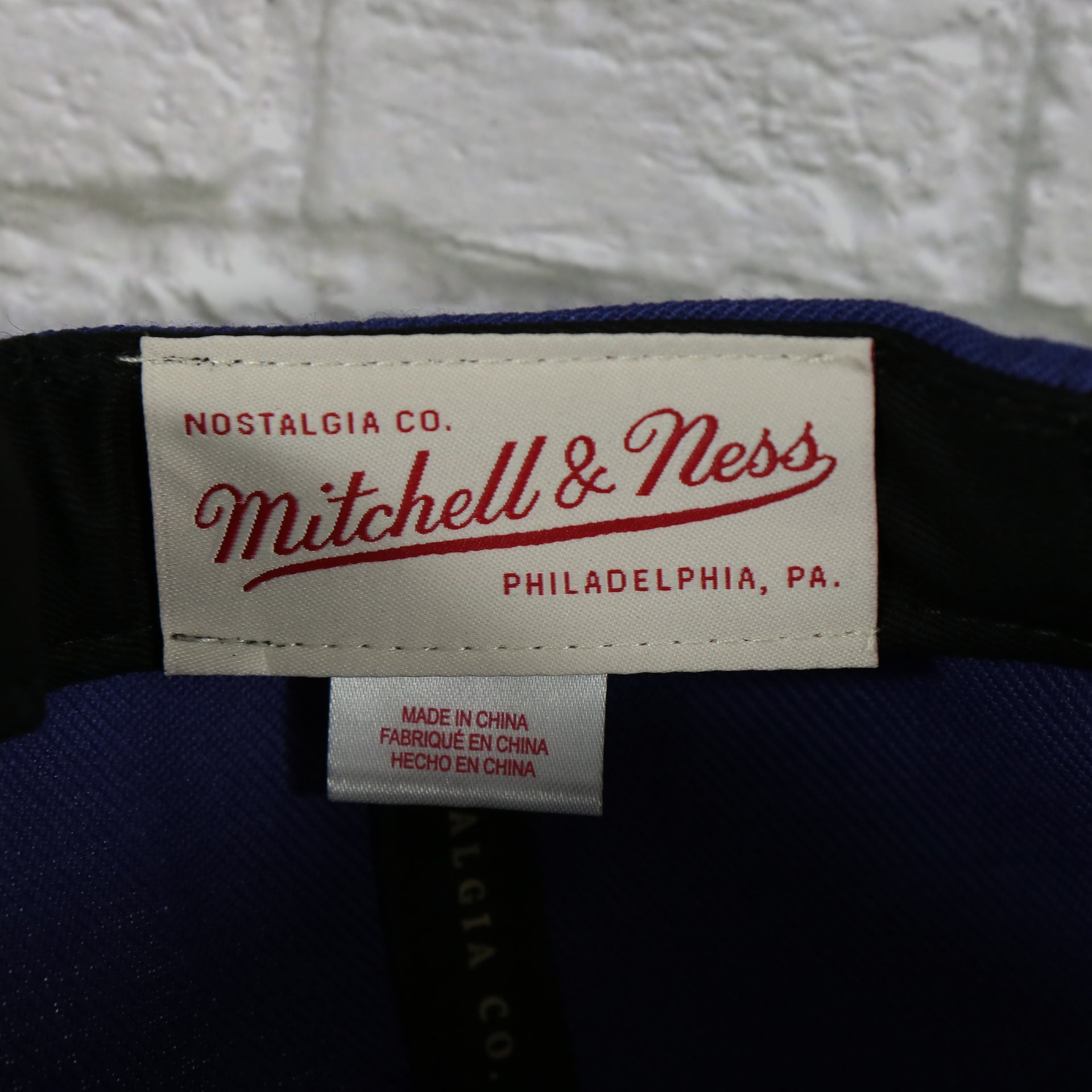 mitchell and ness label on the Phoenix Suns Vintage Retro NBA Team Ground 2.0 Mitchell and Ness Snapback Hat | Purple