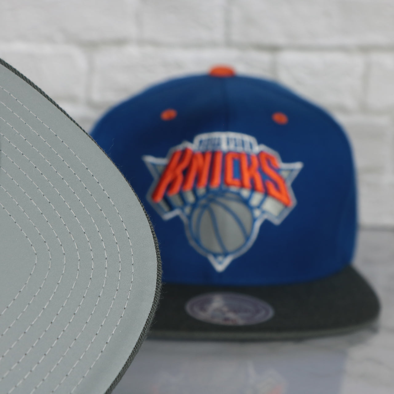 grey undervisor on the New York Knicks Snapback Hat | 3M Reflective Mitchell and Ness Vintage Knicks Snapback Cap