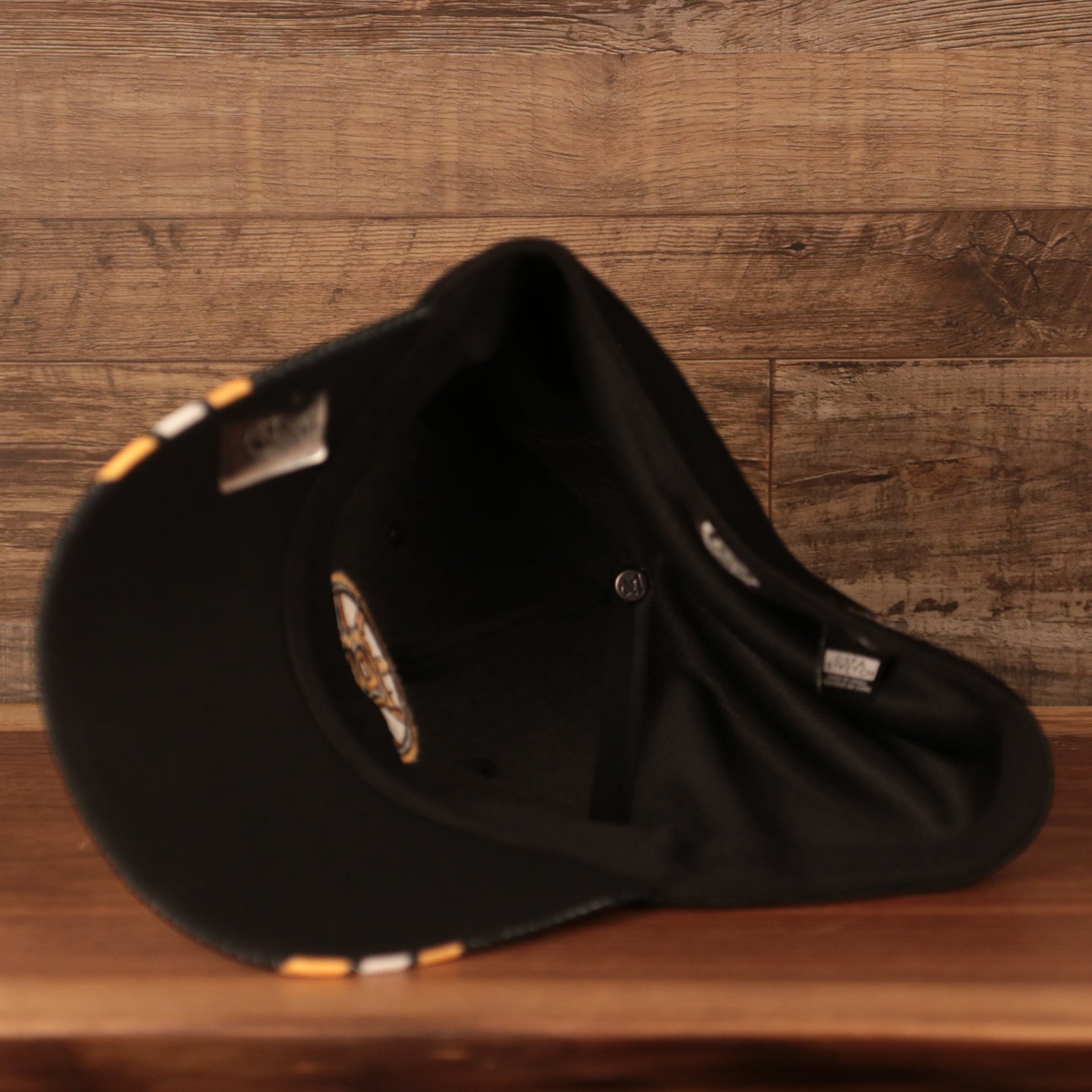 underside of the Boston Bruins Black & Yellow Stretch Fit Dad Hat