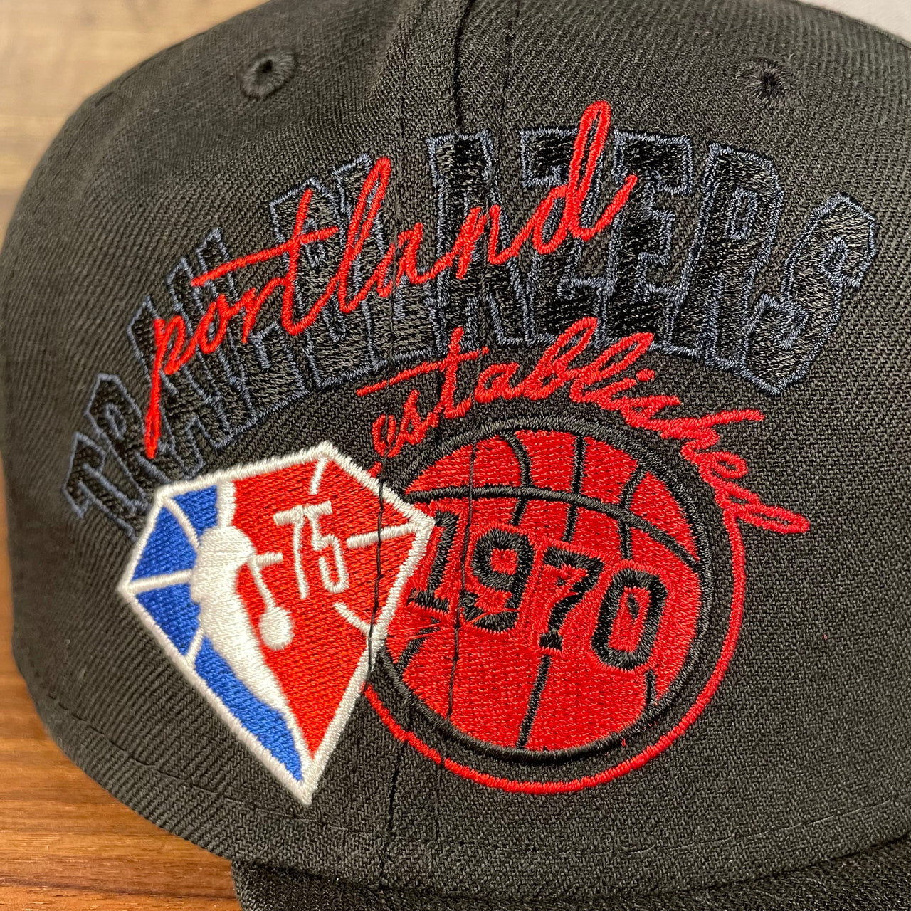 Close up of the side patch on the Portland Trail Blazers NBA 75th Anniversary Side Patch Gray Bottom Black 9Fifty Snapback Hat | Back Half