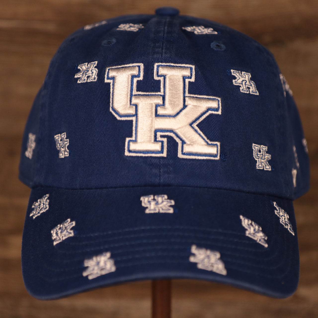 front of the University of Kentucky Wildcats All Over Logo Patch Blue Adjustable Dad Hat
