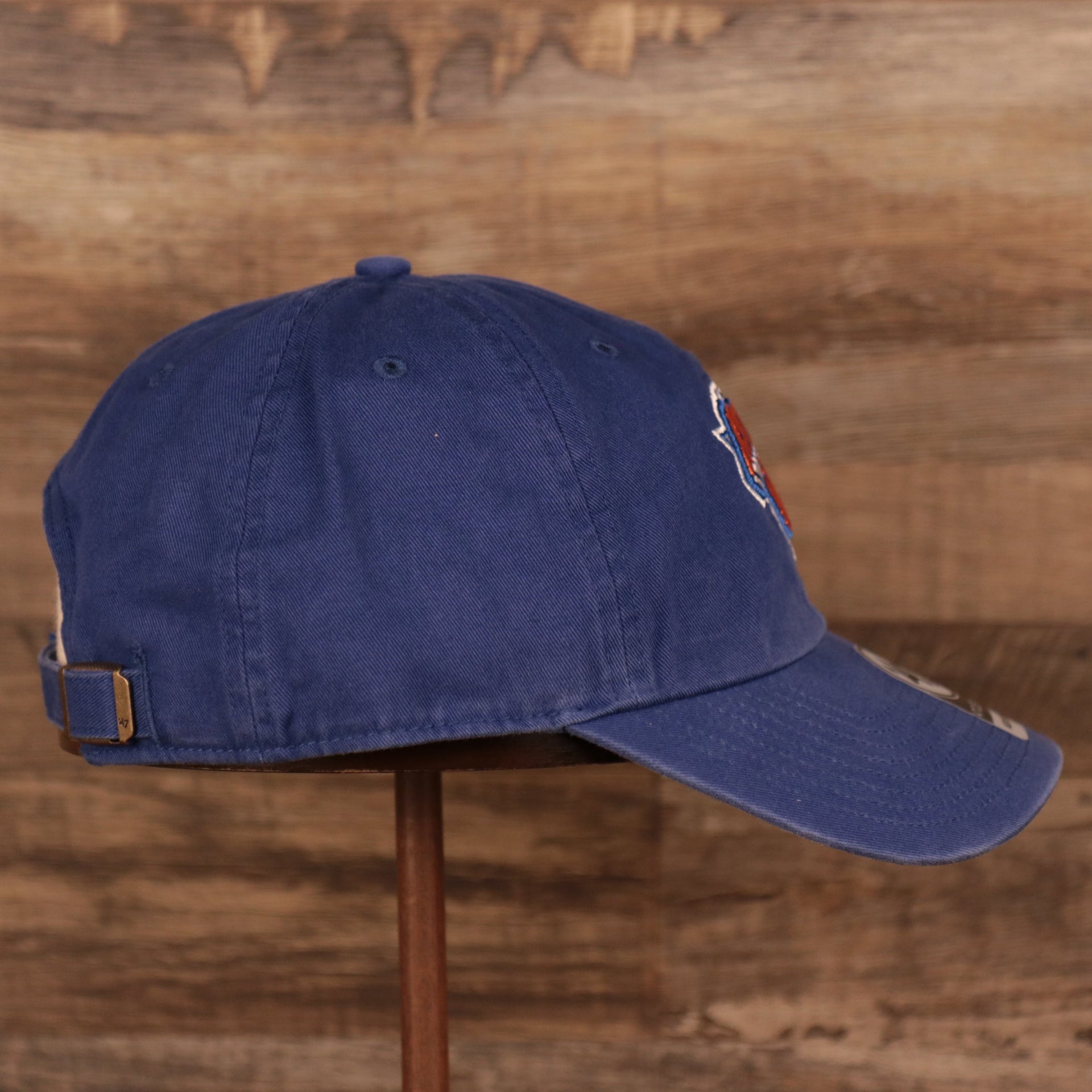 wearers right side of the New York Knicks Royal Blue Adjustable Dad Hat