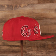 Wearer's right of the Philadelphia Phillies Paisley Elements Bandana Retro Green Bottom 59Fifty Fitted Cap