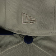 new era logo on the Los Angeles Dodgers World Class 7-Time World Series Champions Two Tone Grey Bottom | Sand/Royal 59Fifty Fitted Cap