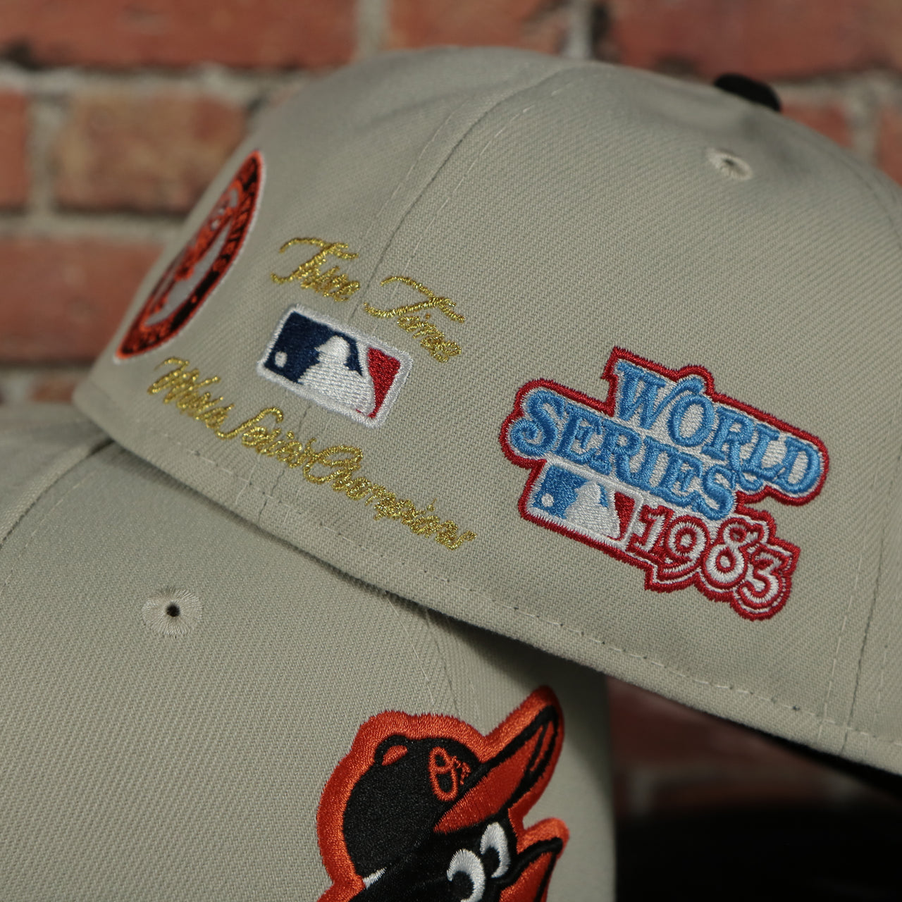 back side of the Baltimore Orioles World Class 3-Time World Series Champions Two Tone Grey Bottom | Sand/Black 59Fifty Fitted Cap