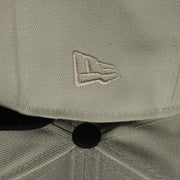 new era logo on the Atlanta Braves World Class 4-Time World Series Champions Two Tone Grey Bottom | Sand/Navy 59Fifty Fitted Cap