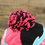 The Pom Pom on the San Antonio Spurs Retro Logo Two Sided Cuffed Winter Beanie | Pink And Black Winter Beanie
