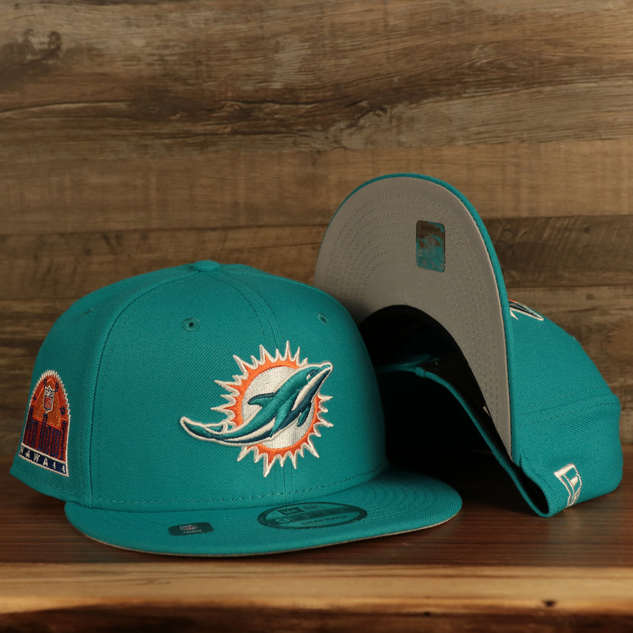 front and bottom of the Miami Dolphins "Patch Up" 1993 Pro Bowl Side Patch Gray Bottom 59Fifty Teal Fitted Cap