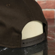 brown adjustable snap on the New Era Cleveland Browns 1959-1969 Vintage logo Grey Bottom | Brown 9Fifty Snapback Hat