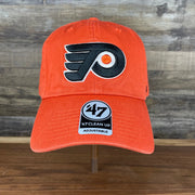 front of the Philadelphia Flyers Orange Adjustable Dad Hat