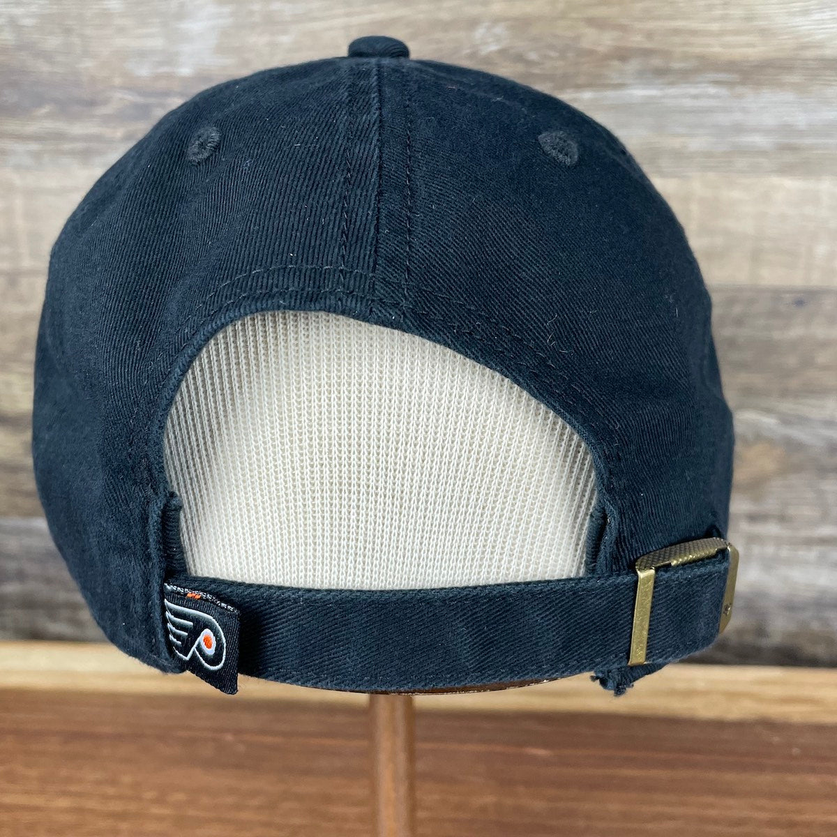 back of the Philadelphia Flyers Gritty Black Adjustable Dad Hat