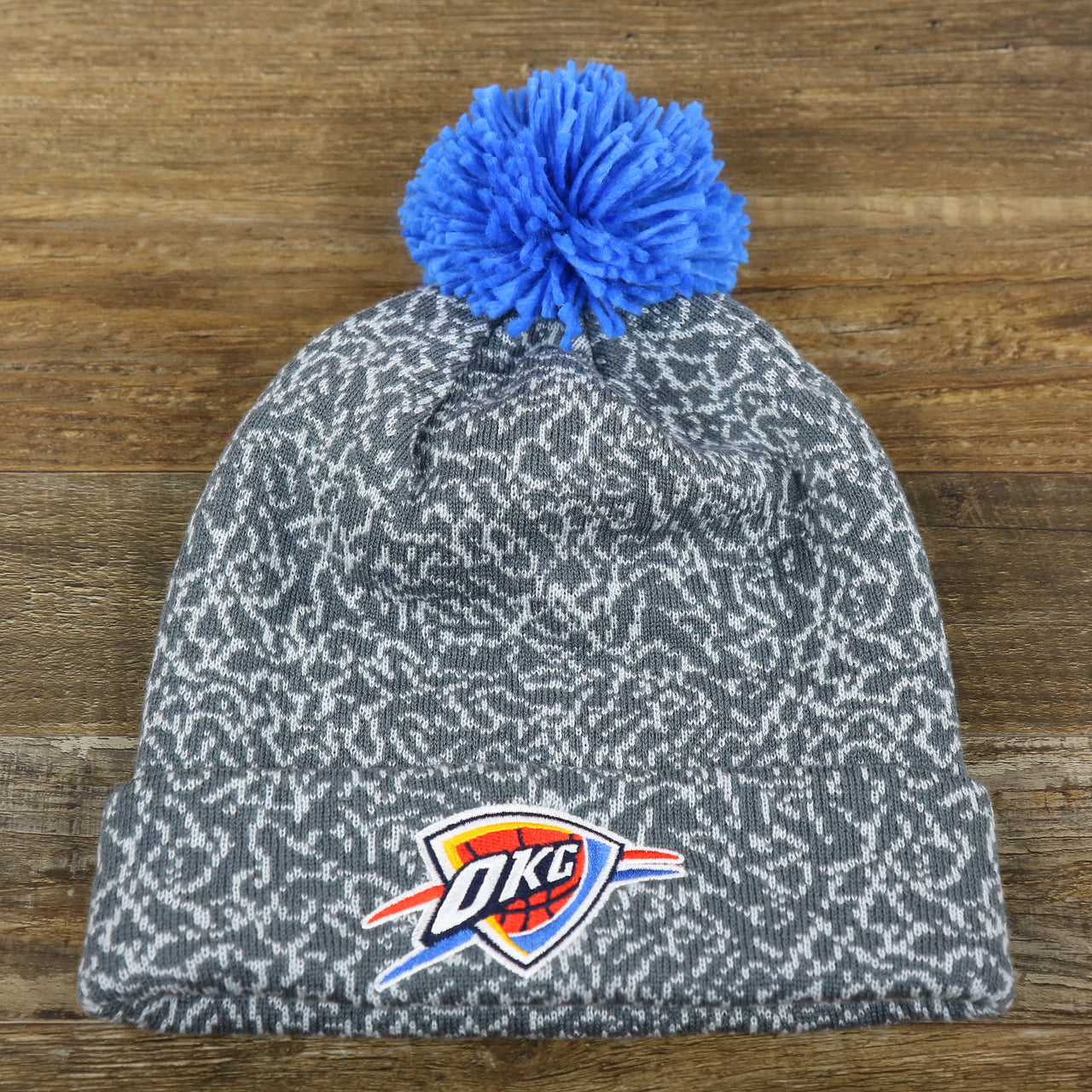 The front of the Oklahoma City Thunder Jordan 3 Matching Concrete Print Winter Beanie With Pom Pom | Gray Winter Beanie