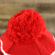 The Pom Pom on the DC Comics Deadpool Mask Logo Deadpool Wordmark Striped Beanie With Red Pom Pom | Red And Black Winter Beanie