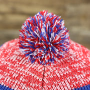 The Multi Colored Pom Pom on the Kid’s New York Giants Striped Pom Pom Winter Beanie | Royal Blue, Red, And White Beanie