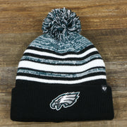 The front of the Kid’s Philadelphia Eagles Striped Pom Pom Winter Beanie | Black, Midnight Green, And White Beanie