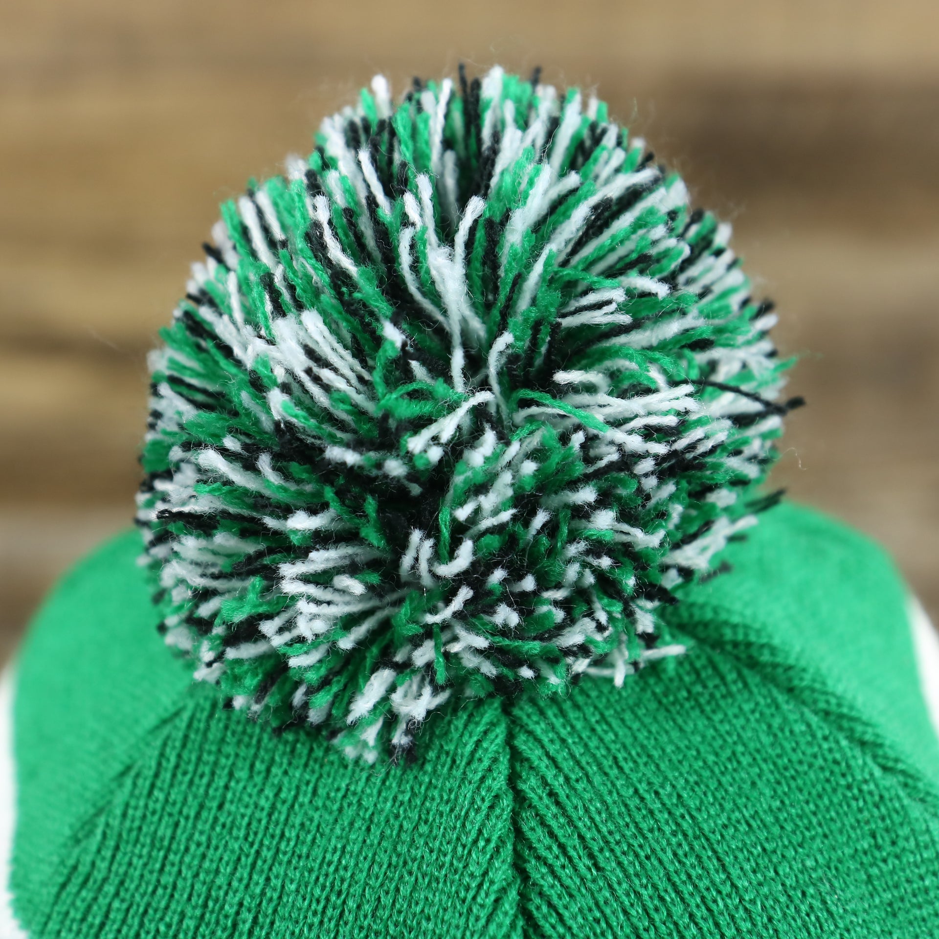 The Pom Pom on the Legacy Philadelphia Eagles Cuffed Logo Striped Winter Beanie With Pom Pom | Kelly Green Winter Beanie