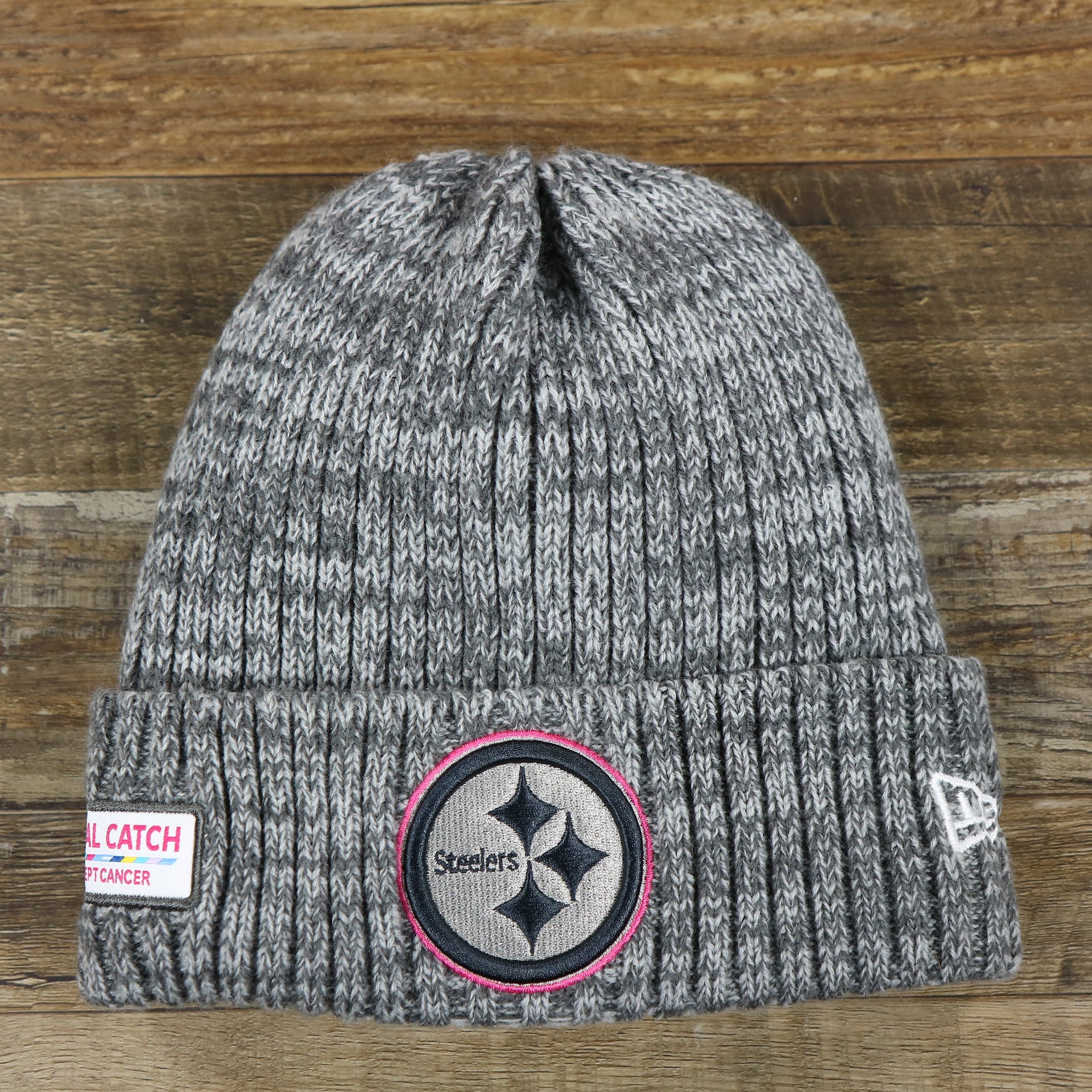 The front of the Pittsburgh Steelers On Field Crucial Catch Winter Knit Graphite Beanie | Gray Winter Beanie