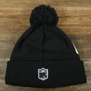 The backside of the Dallas Cowboys On Field Rubber Cowboys 1960 Patch Cuffed Pom Pom Winter Beanie | Black Winter Beanie
