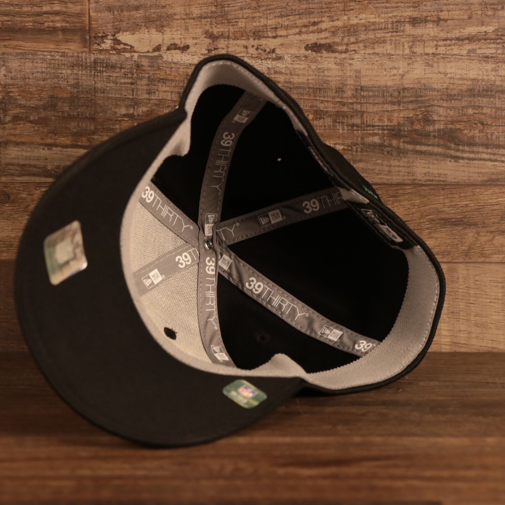 Moisture wicking sweatband on the interior of the Philadelphia Eagles 2021 Sideline On-Field Throwback Logo 39Thirty Stretch Cap