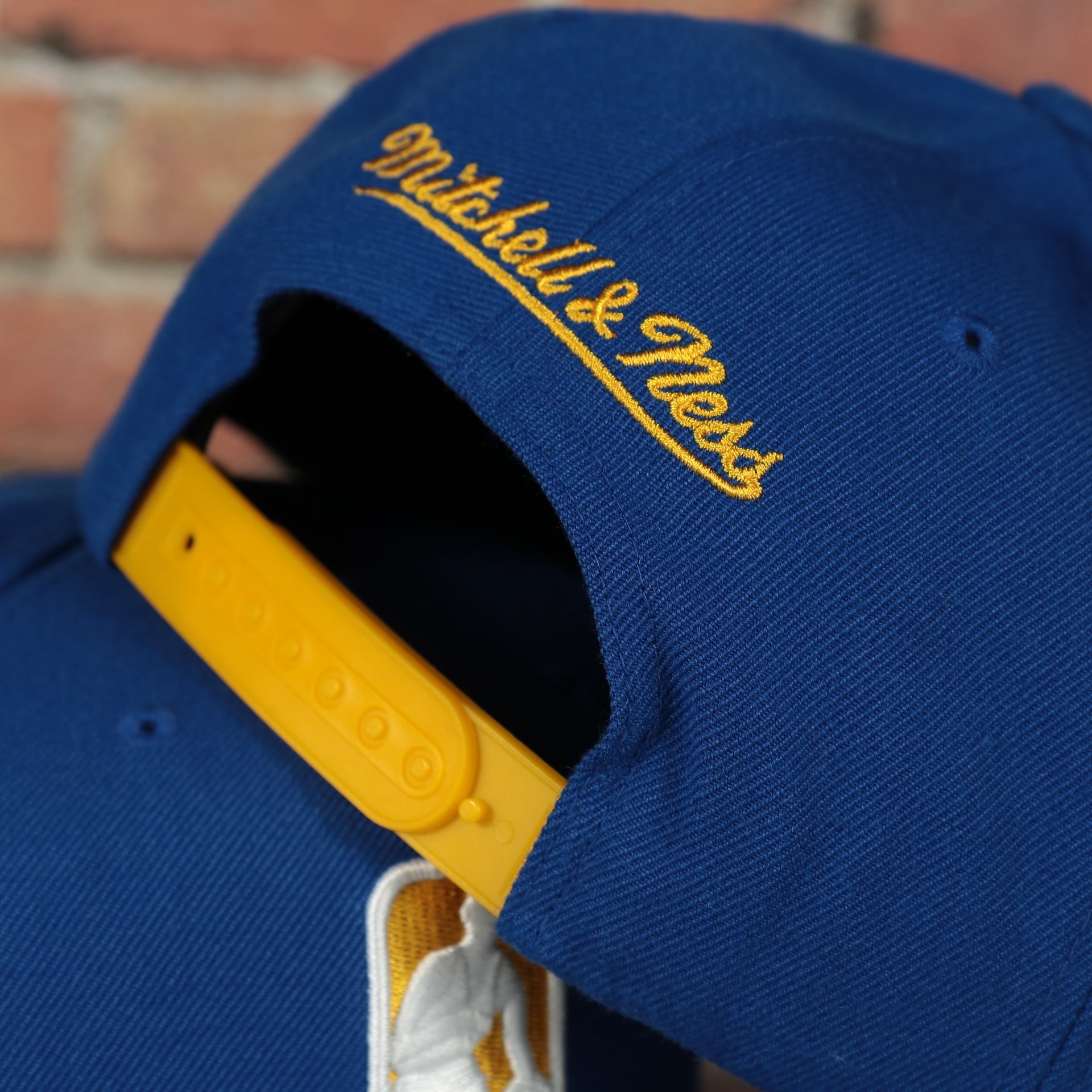 yellow adjustable snap on the Golden State Warriors NBA Logo Team Colorway Blue Snapback Hat